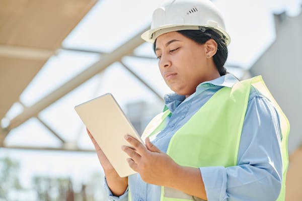 Engineer using digital tablet at plant